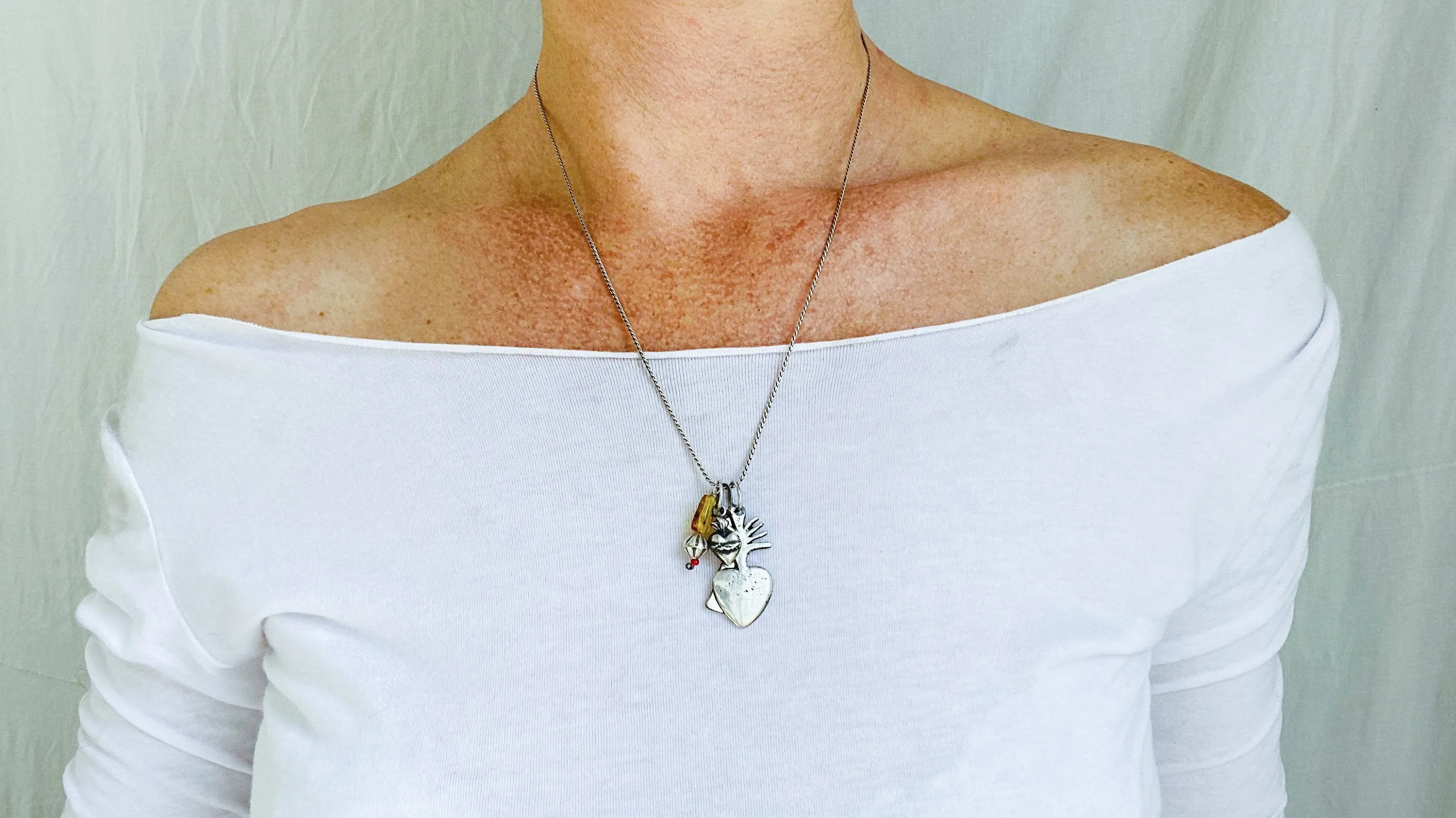 Milagro Pendants Necklace. Mexico. Sterling Silver and Amber.